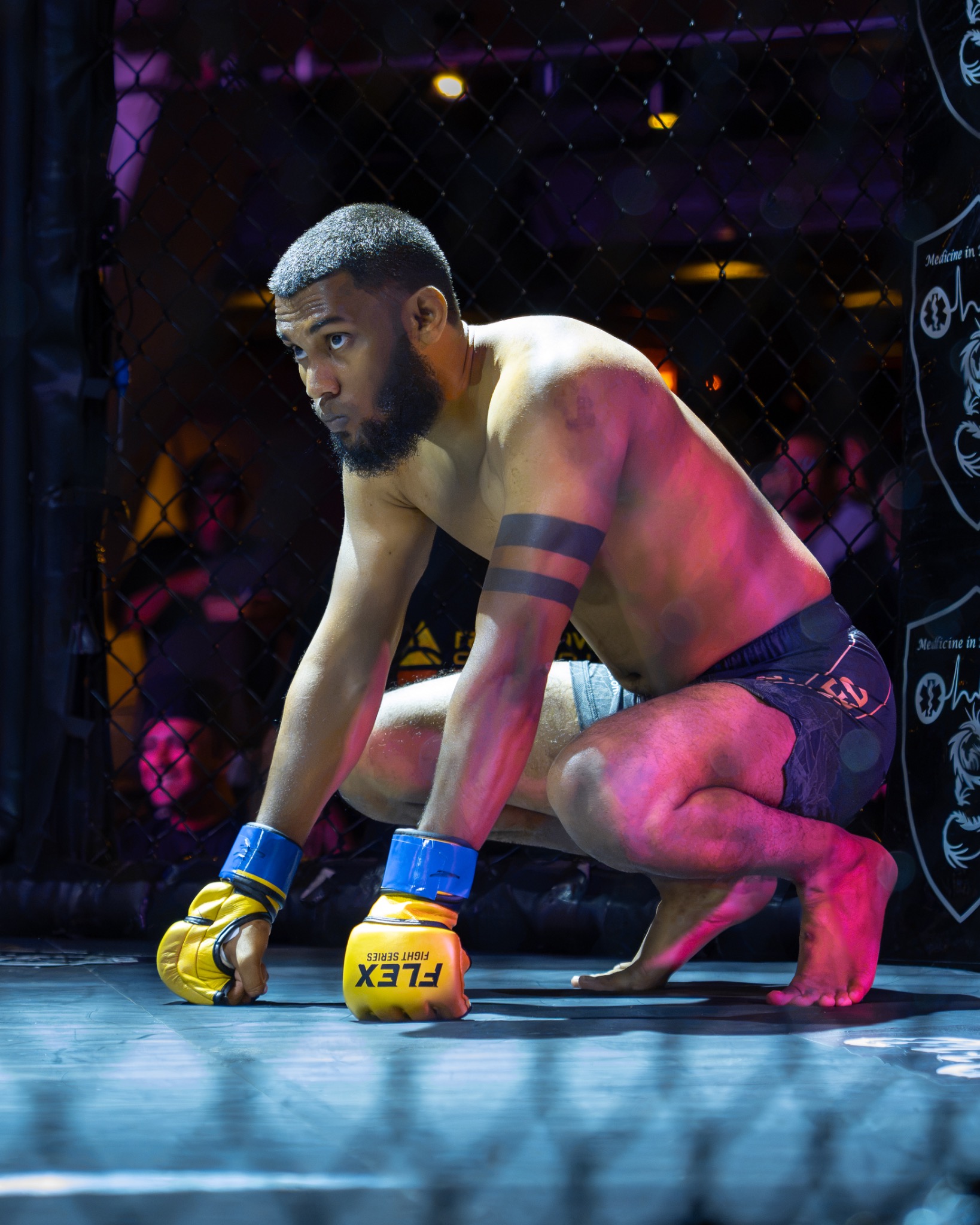 Safraz crouches in the cage before his Flex Fight Series bout